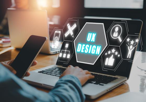 Designer working with laptop and phone